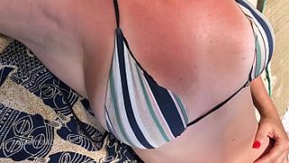 Married woman in tiny bikini at the beach